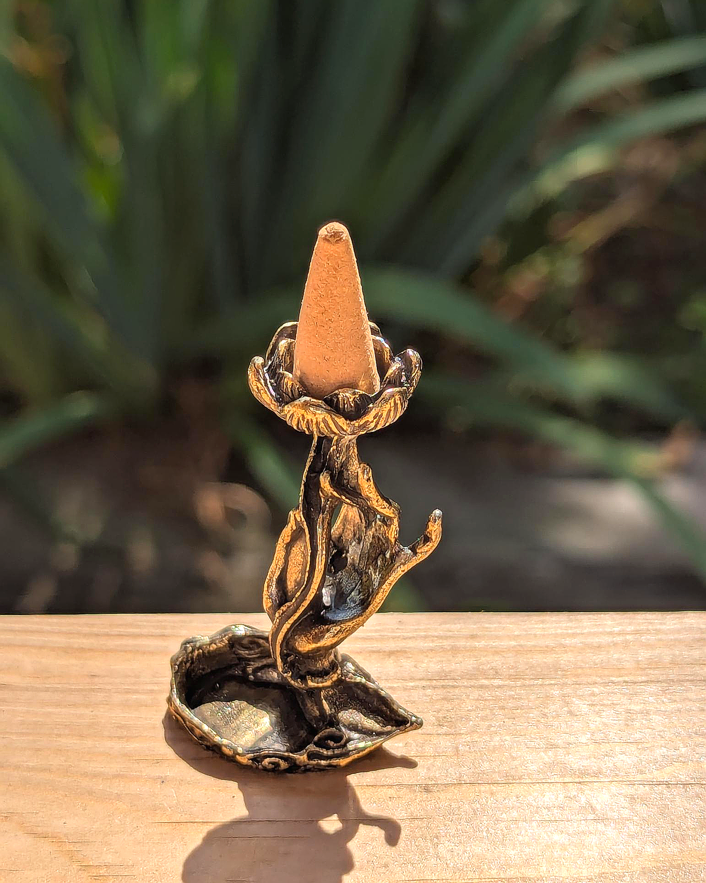 Hand Holding Flower Backflow Incense Holder